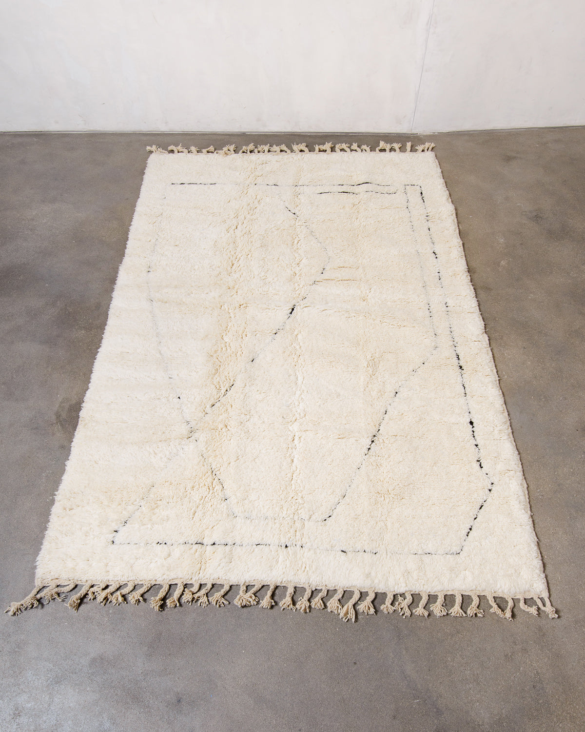 Modern, designer, handcrafted Berber rug from Morocco. Beniourain carpet with minimalist design, natural wool pile and a fluffy texture.